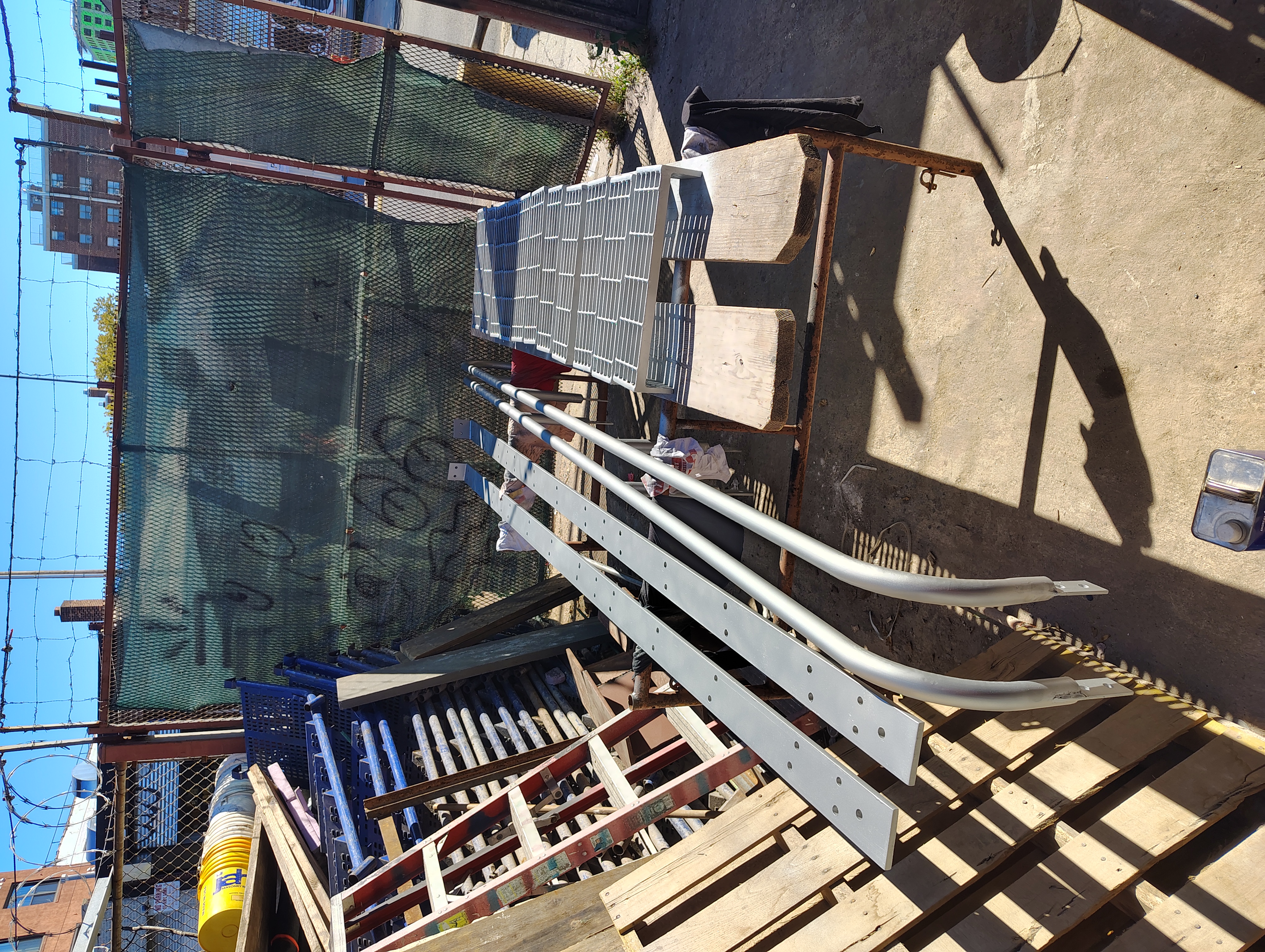 Coated stringers, curved handrails and grating treads ready for assembly