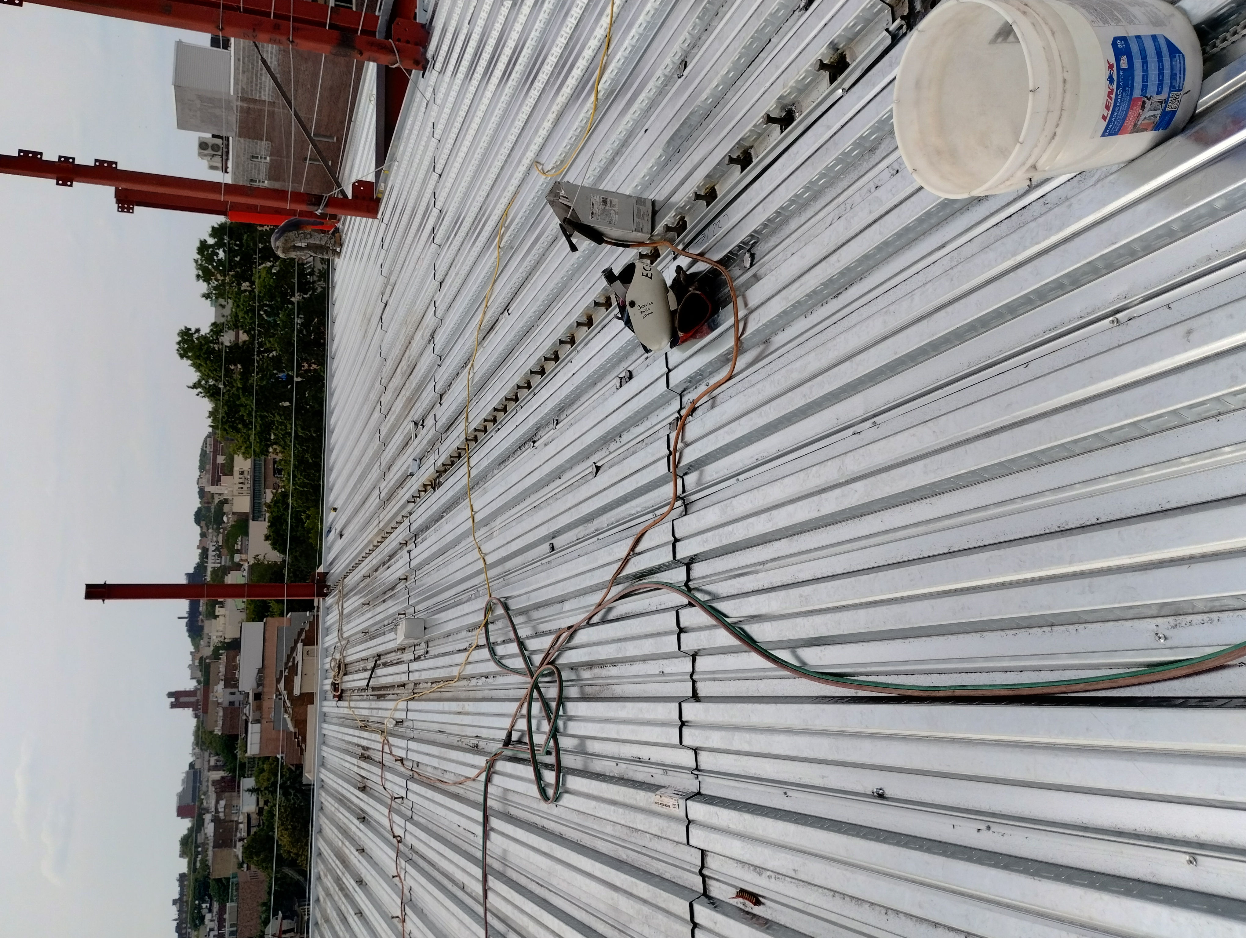 Corrugated metal floor decking with steel columns and rows of shear studs