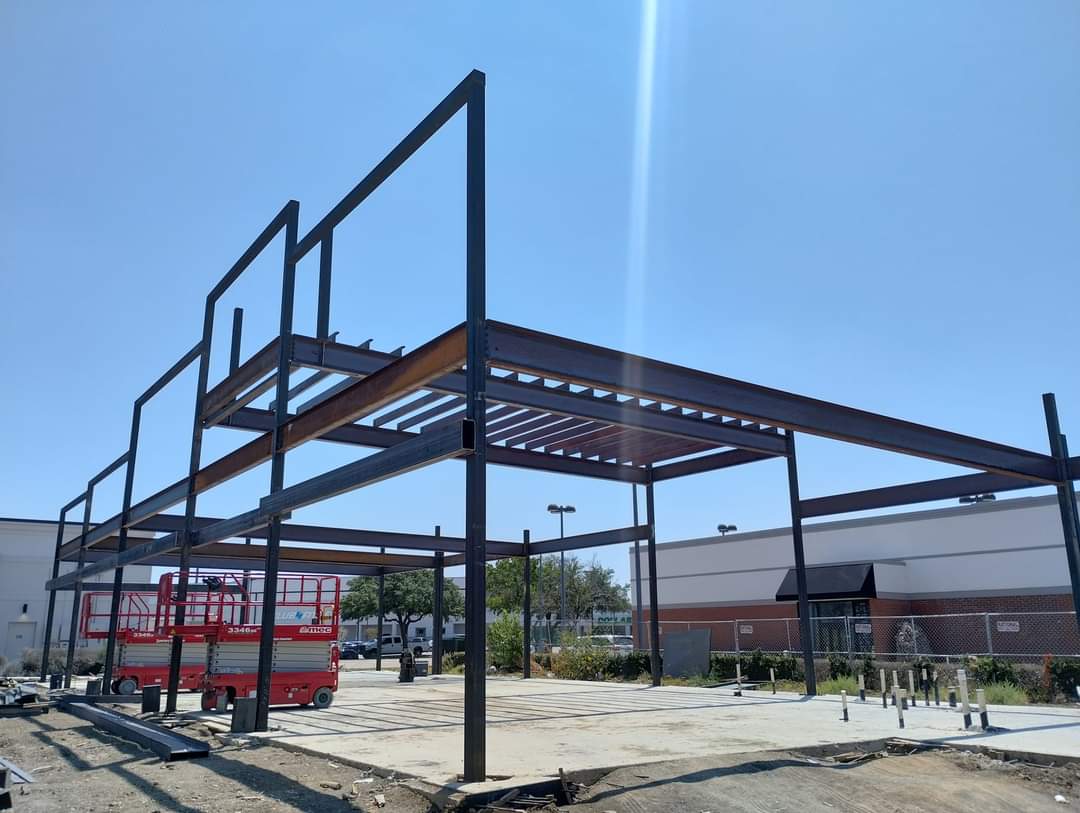 Steel columns and beams forming a building frame
