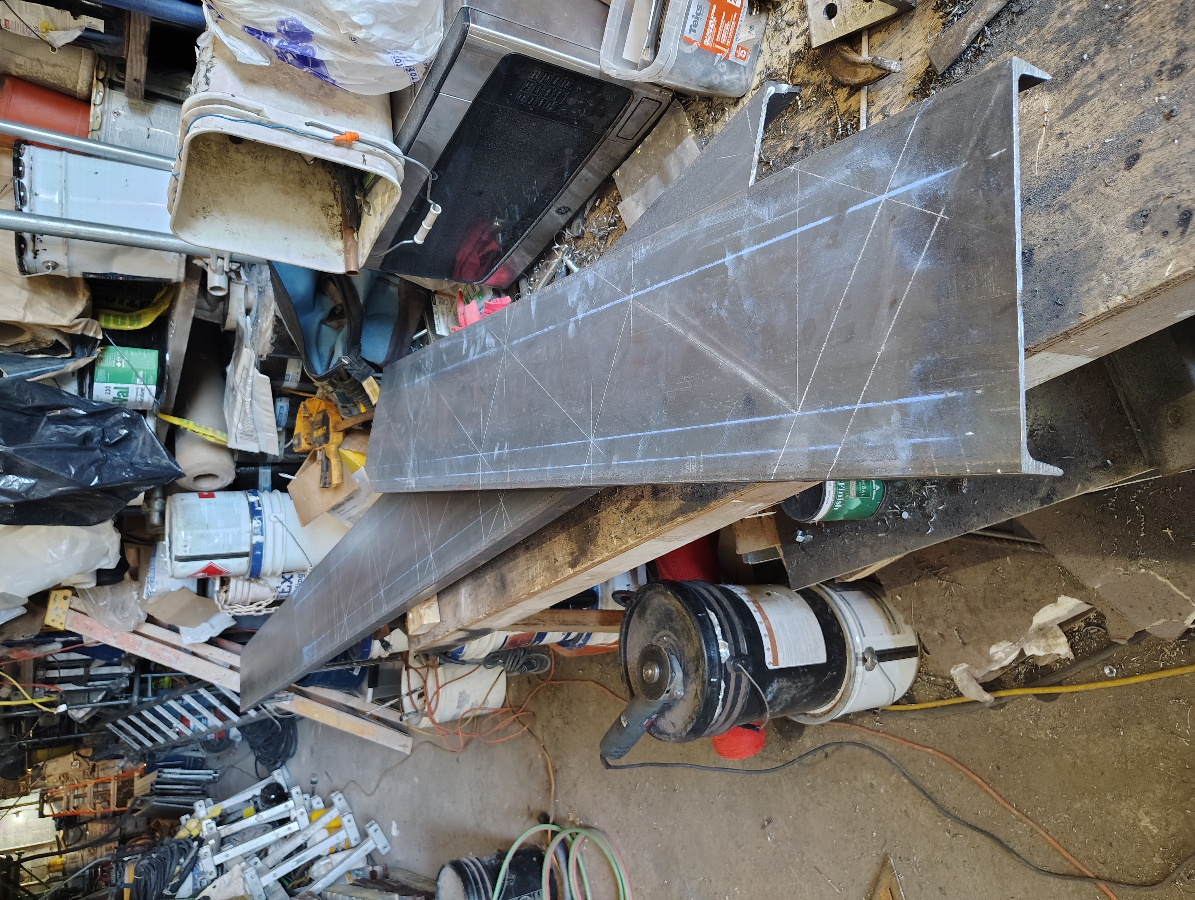 Chalk step layout marked on steel channel stringers