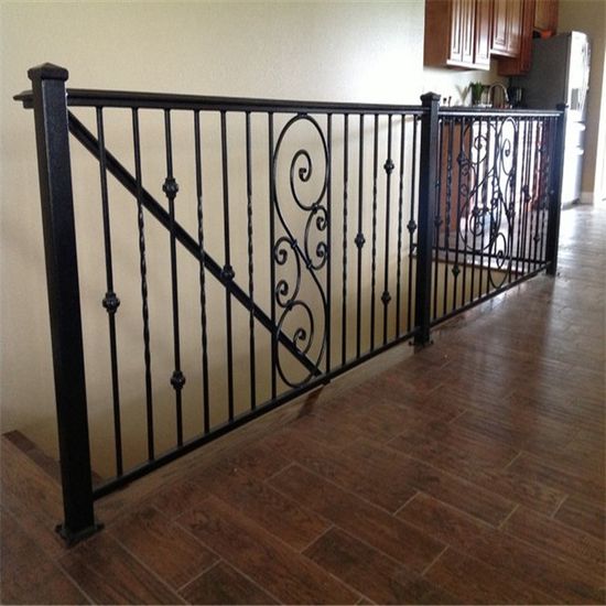 Interior railing with decorative scrollwork and vertical bars