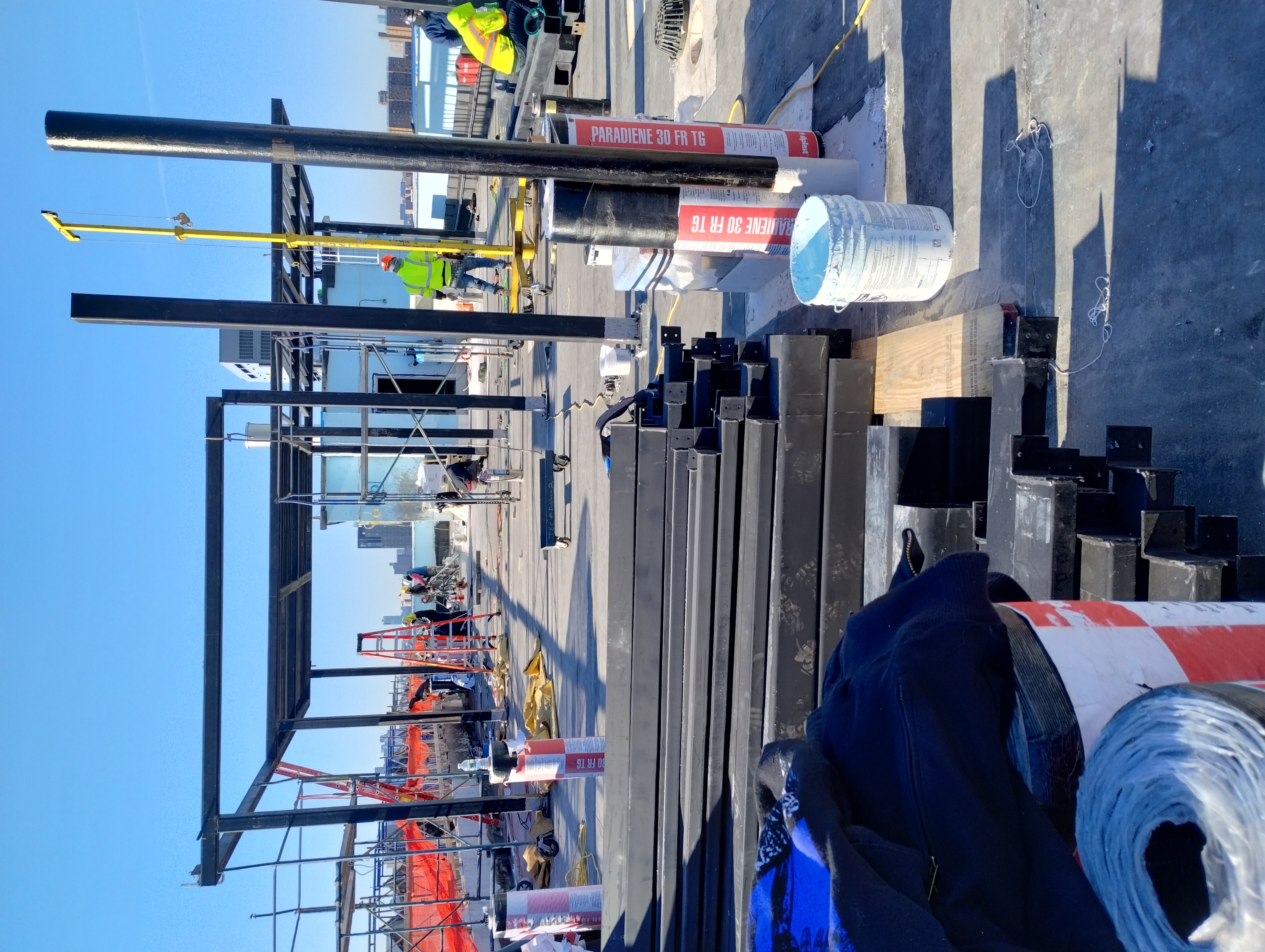 Steel columns and roof framing being assembled on a rooftop
