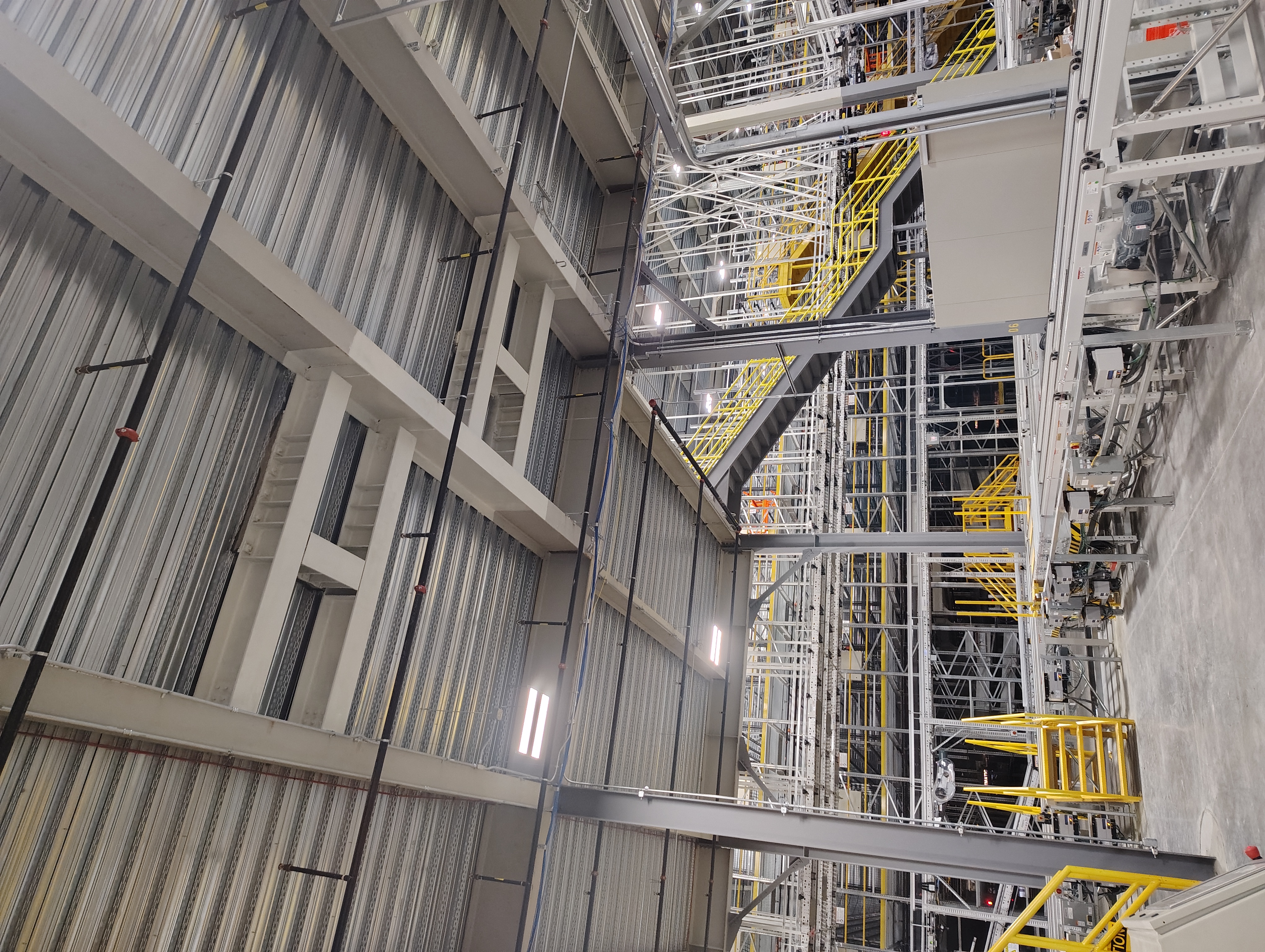 Completed overhead steel framing inside a warehouse