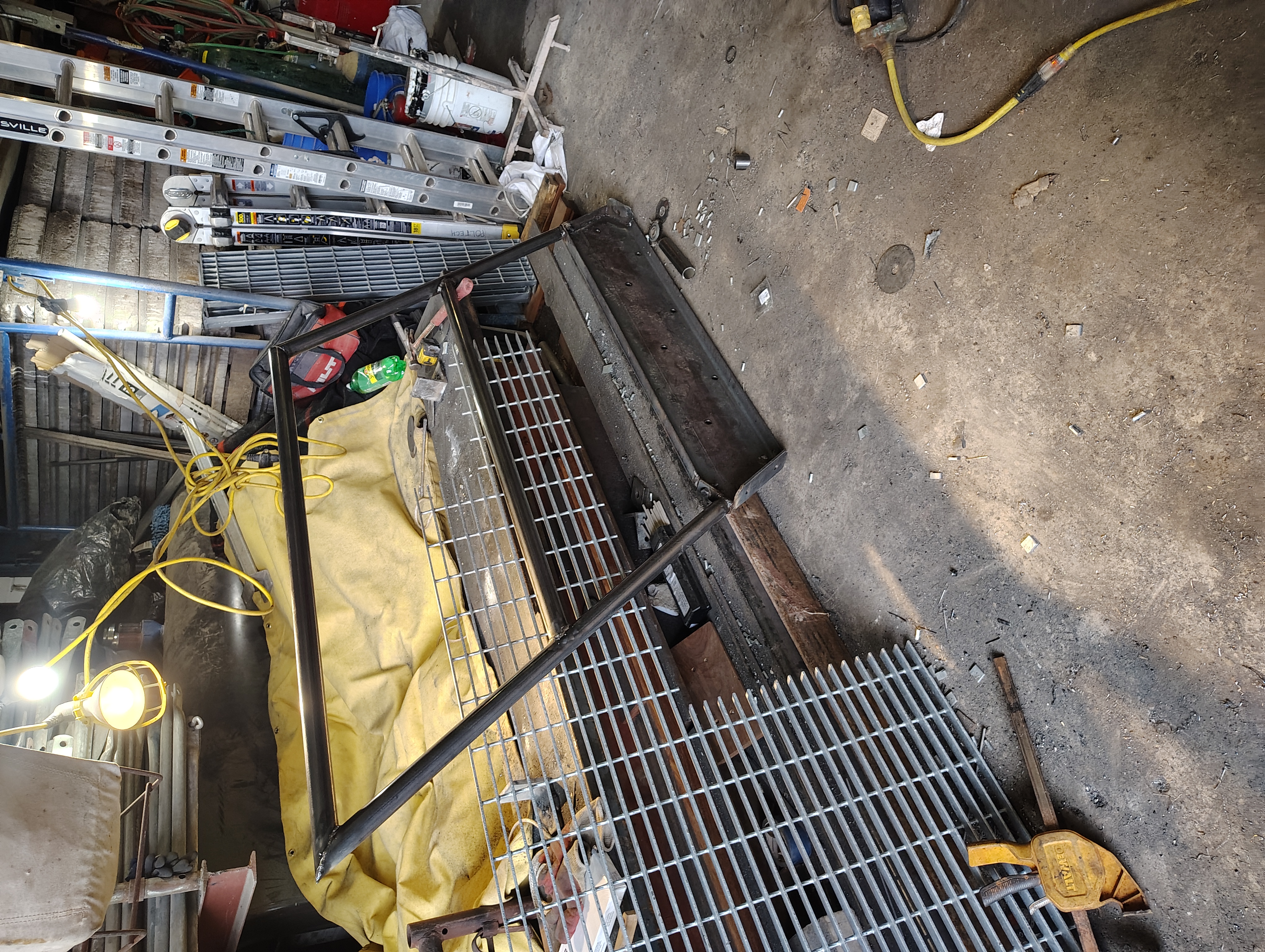 Tubular steel handrail frame and grating components in the workshop